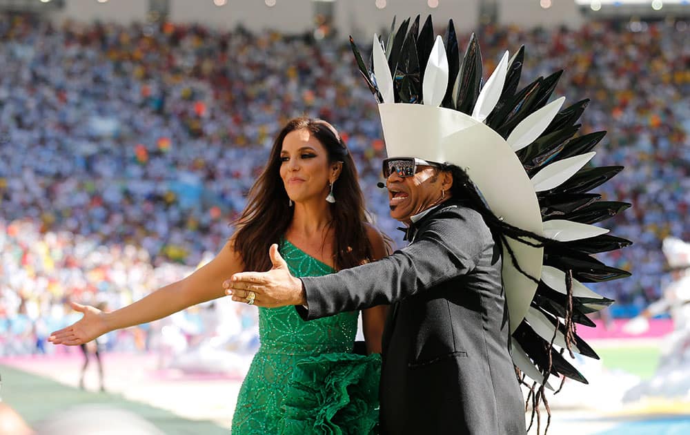 Brazilian singers Ivete Sangalo, left, and Carlinhos Brown perform during the closing ceremony for the World Cup before the final match between Germany and Argentina at Maracana Stadium in Rio de Janeiro, Brazil.