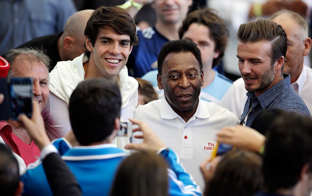 Brazil's former soccer player Zico, Brazil's player Kaka, Brazilian soccer legend Pele and former English player David Beckham have their picture taken as they arrive to attend the World Cup final soccer match between Germany and Argentina at the Maracana Stadium in Rio de Janeiro, Brazil