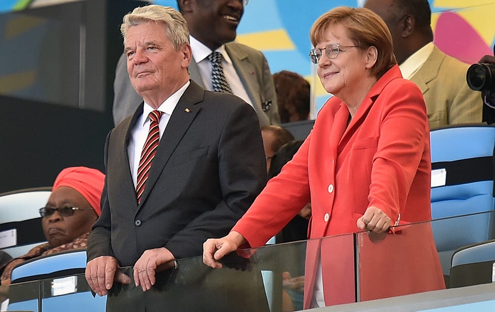 German President Joachim Gauck, left, and Chancellor Angela Merkel wait for the World Cup final soccer match between Germany and Argentina to begin at the Maracana Stadium in Rio de Janeiro, Brazil.