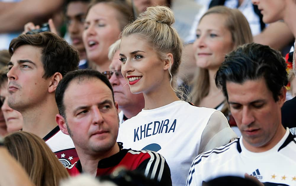 Lena Gercke, the girlfriend of Germany's Sami Khedira, waits for the start of the World Cup final soccer match between Germany and Argentina at the Maracana Stadium in Rio de Janeiro, Brazil