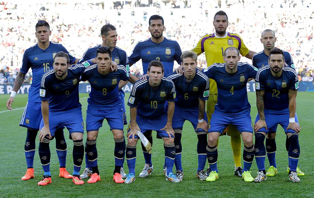 The Argentine national team pose before the World Cup final soccer match between Germany and Argentina at the Maracana Stadium in Rio de Janeiro, Brazil