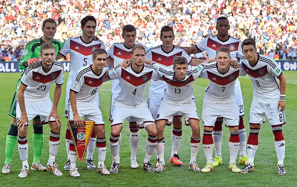 The German team poses for a group photo before the World Cup final soccer match between Germany and Argentina at the Maracana Stadium in Rio de Janeiro, Brazil.