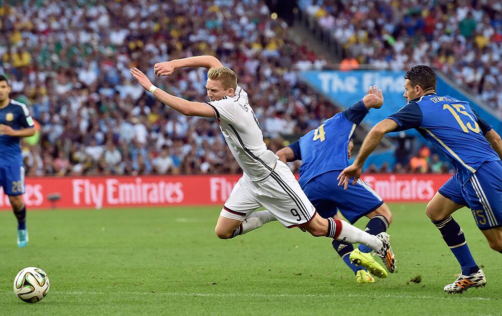 Germany's Andre Schuerrle (9) goes down in the penalty box for which no penalty was awarded during the World Cup final soccer match between Germany and Argentina at the Maracana Stadium in Rio de Janeiro.