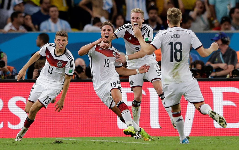 Germany's Mario Goetze (19) celebrates after scoring the opening goal during the World Cup final soccer match between Germany and Argentina at the Maracana Stadium in Rio de Janeiro.