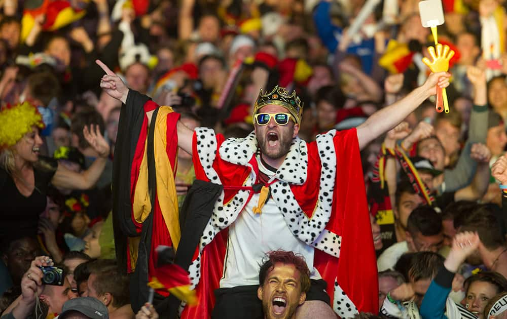 German soccer fans react after the deciding goal for Germany in the final of the Brazil World Cup 2014 between Germany and Argentina played in Rio de Janeiro, Brazil.