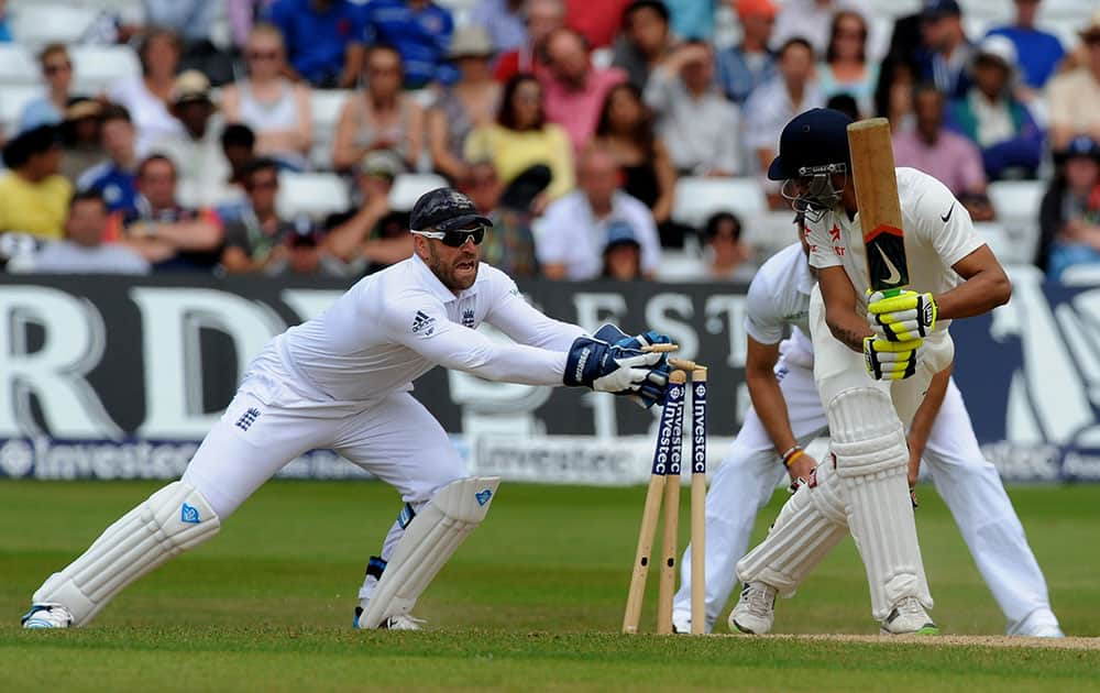 England's Matt Prior, left, attempts to stump India's Ravindra Jadeja during day five of the first Test between England and India at Trent Bridge cricket ground, Nottingham