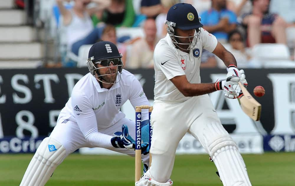 India's Bhuvneshwar Kumar plays a shot watched by England's Matt Prior, left, during day five of the first Test between England and India at Trent Bridge cricket ground, Nottingham, England.