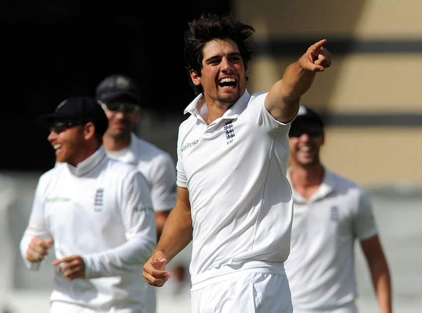 England's Alastair Cook celebrates after bowling India's Ishant Sharma caught Matt Prior for 13 runs during day five of the first Test between England and India at Trent Bridge cricket ground, Nottingham.