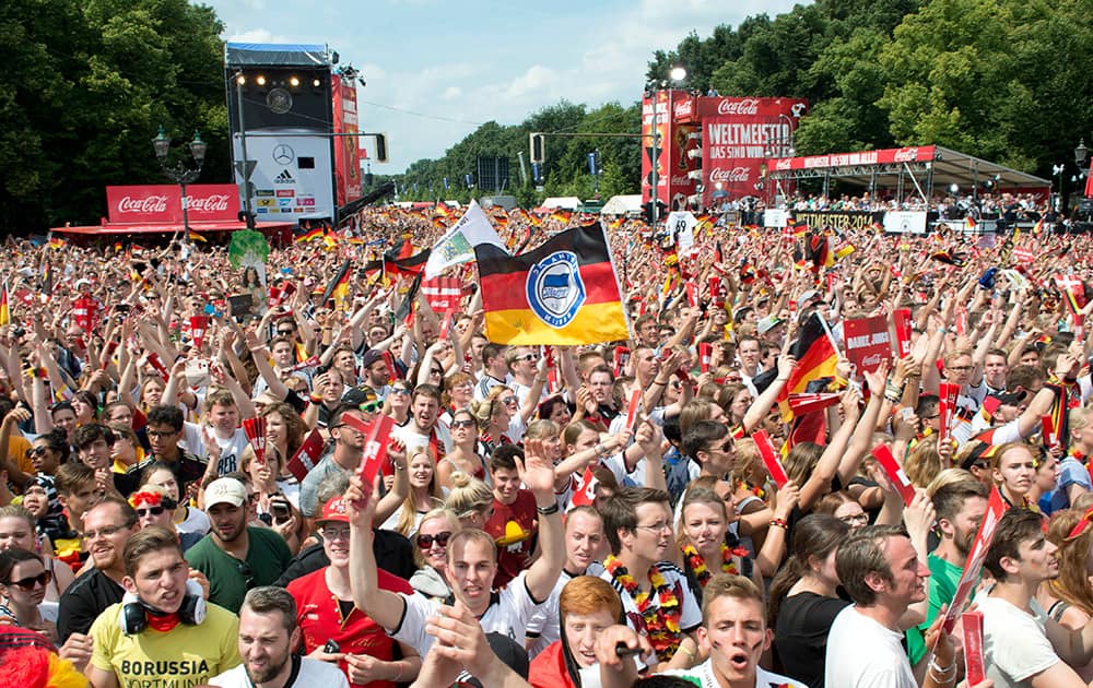 Hundred thousands of people wait for the arrival of the German national soccer team at the Brandenburg Gate in Berlin.