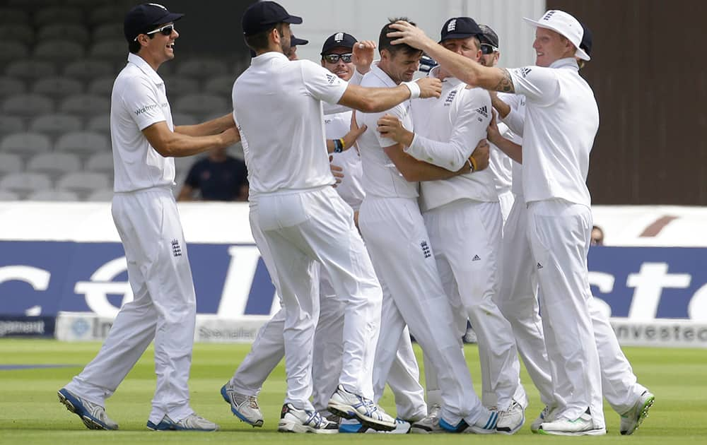 England's James Anderson celebrates the wicket of India's Shikhar Dhawan during the first day of the second test match between England and India at Lord's cricket ground in London.