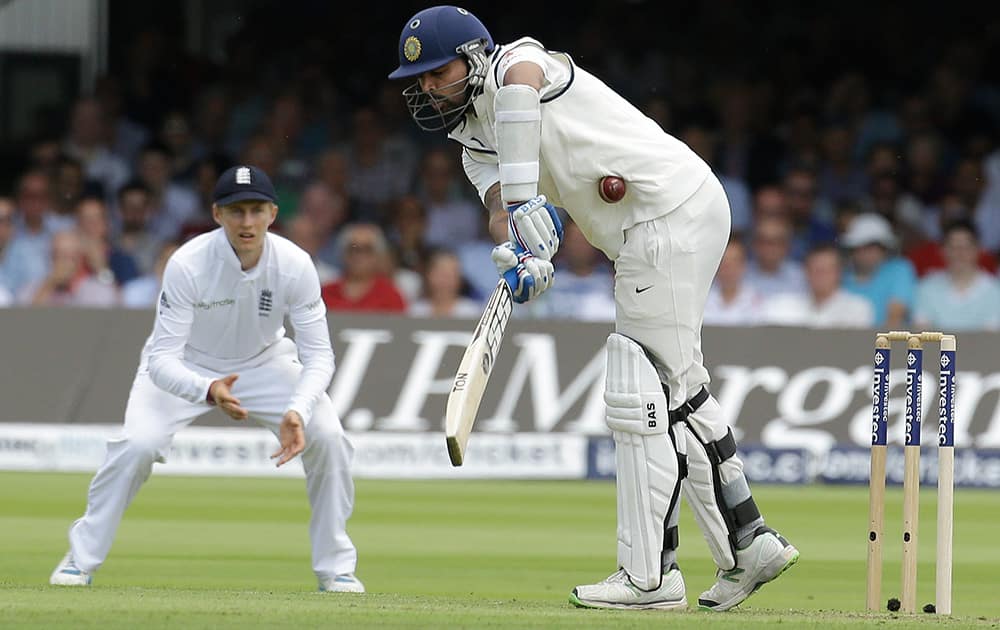 India's Murali Vijay plays a shot off the bowling of England 's James Anderson during the first day of the second test match between England and India at Lord's cricket ground in London.