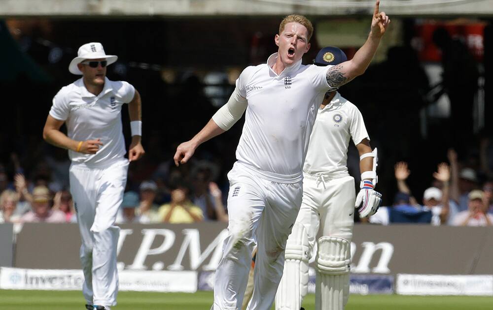 England's Ben Stokes celebrates the wicket of India's Cheteshwar Pujara during the first day of the second test match between England and India at Lord's cricket ground in London.