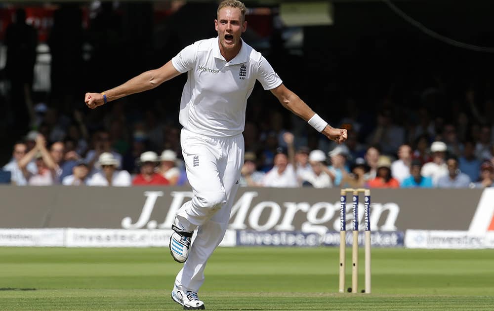 England's Stuart Broad celebrates the wicket of India's MS Dhoni during the first day of the second test match between England and India at Lord's cricket ground in London.