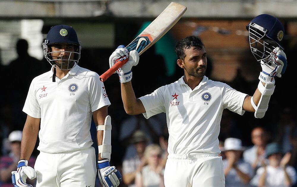 Ajinkya Rahane, right, celebrates scoring a century alongside batting partner Mohammed Shami during the first day of the second test match between England and India at Lord's cricket ground in London.