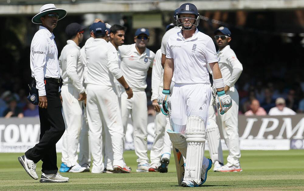 England's Ian Bell leaves the field after being caught by Ravindra Jadeja off the bowling of India's Bhuvneshwar Kumar during the second day of the second test match between England and India at Lord's cricket ground in London.