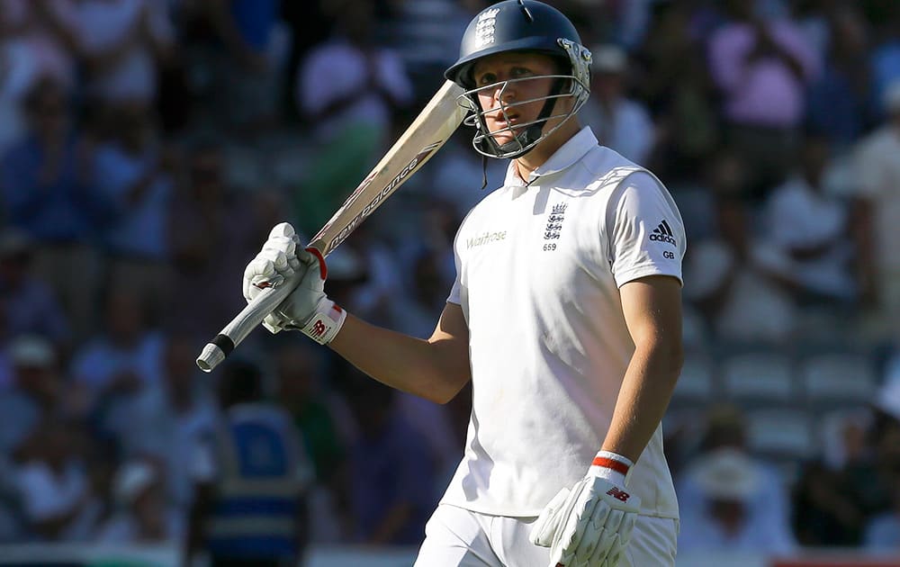 England's Gary Ballance leaves the field after being caught by MS Dhoni off the bowling of India's Bhuvneshwar Kumar during the second day of the second test match between England and India at Lord's cricket ground in London.