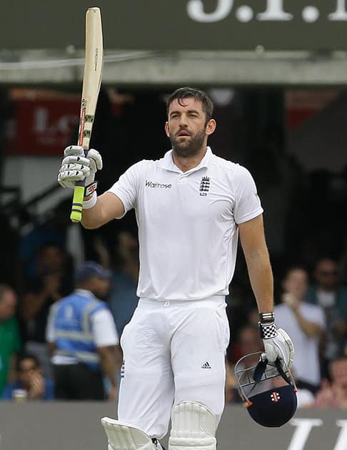 England's Liam Plunkett celebrates scoring a half century during the third day of the second test match between England and India at Lord's cricket ground in London.