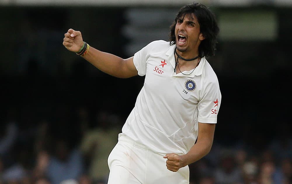 India's Ishant Sharma celebrates the wicket of England's Ian Bell during the fourth day of the second test match between England and India at Lord's cricket ground in London.