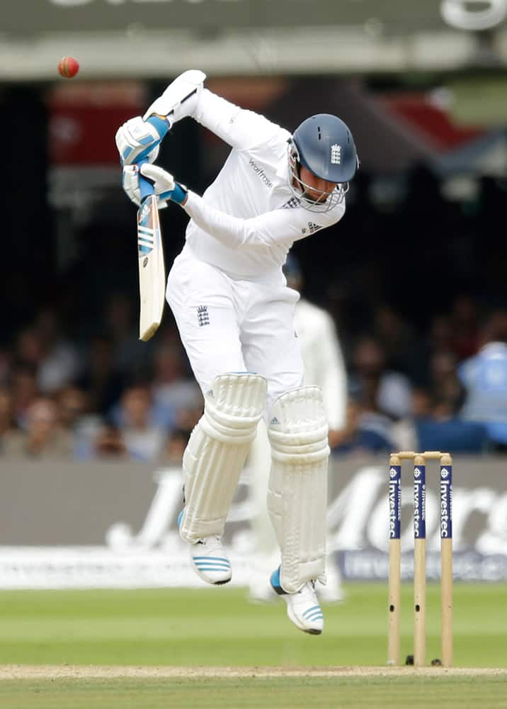 England's Stuart Broad tries to avoid a bouncer form India's Ishant Sharma on the fifth day of the second cricket test match between England and India at Lord's cricket ground in London.