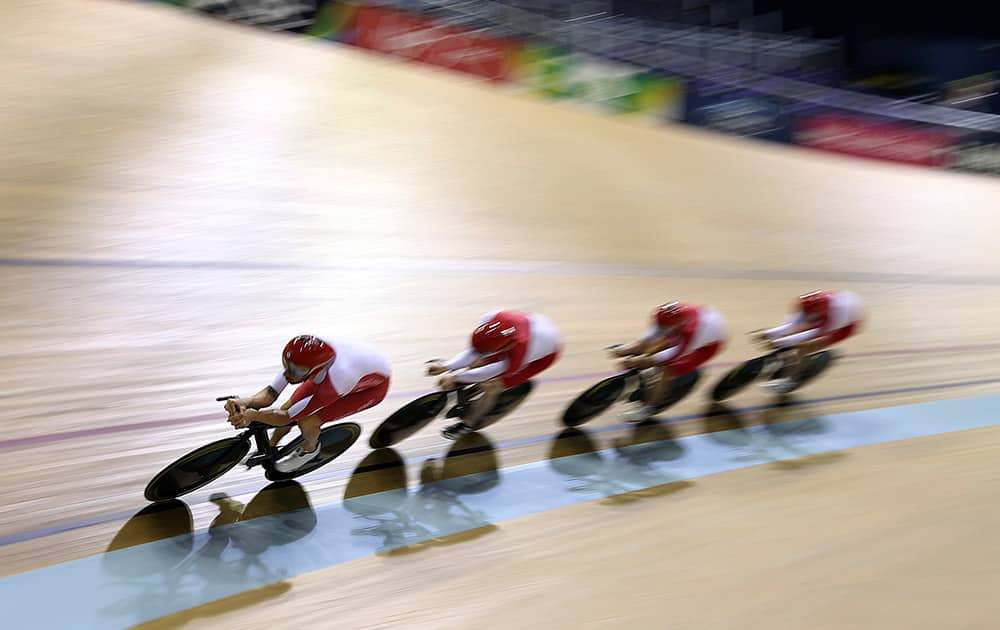 England's Bradley Wiggins leads his cycle teammates during a training session in the Velodrome ahead of the start of the Commonwealth Games 2014 in Glasgow, Scotland.