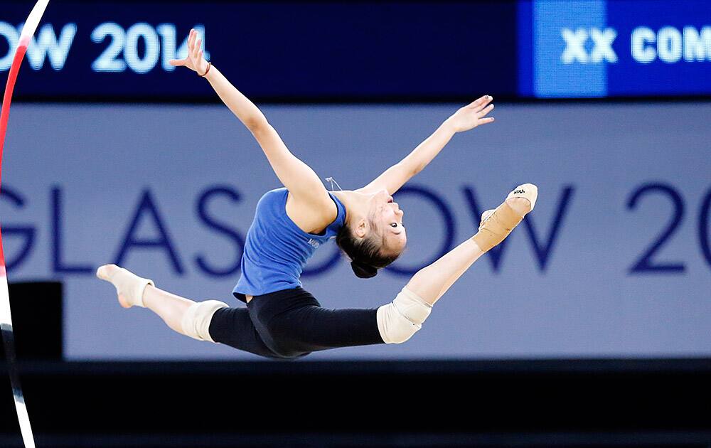 A rhythmic gymnastic athlete practices one day before the opening of the Commonwealth Games 2014 in Glasgow, Scotland.