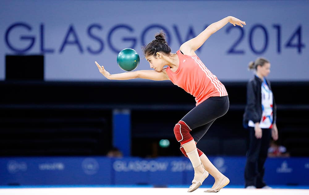 A rhythmic gymnastic athlete practices one day before the opening of the Commonwealth Games 2014 in Glasgow, Scotland.