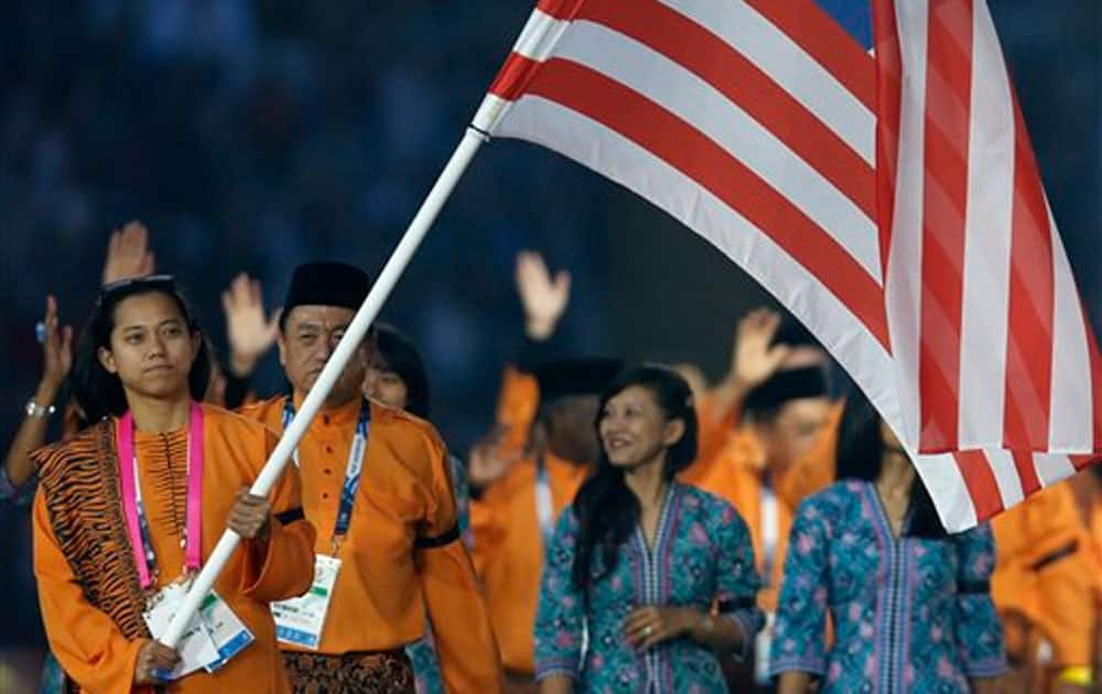 Malaysia’s flag bearer Muhammad Imaadi Aba Aziz during the opening ceremony for the Commonwealth Games 2014 in Glasgow, Scotland.