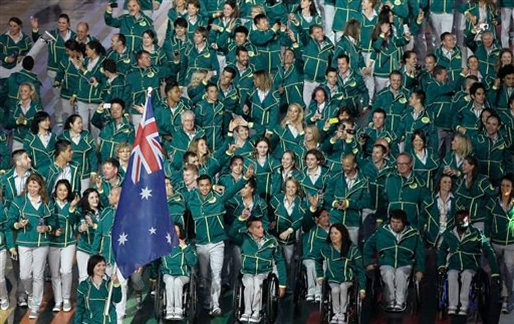 Australia’s flag bearer Anna Meares leads the Australian team during the opening ceremony for the Commonwealth Games 2014 in Glasgow, Scotland.