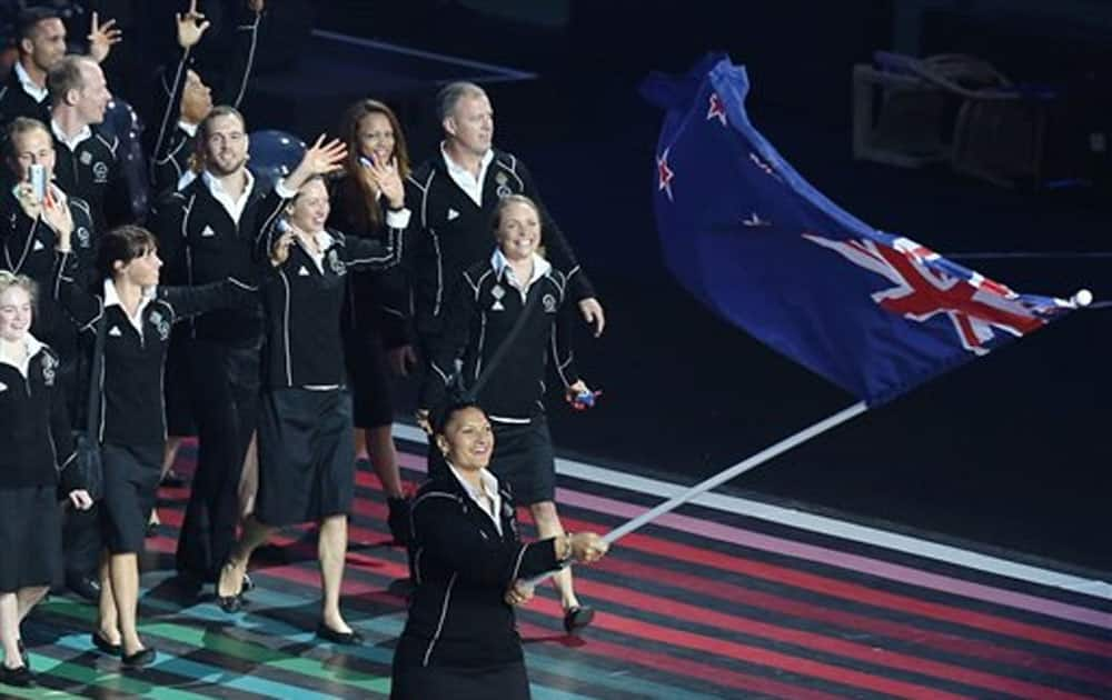 New Zealand’s flag bearer Valerie Adams leads her team during the opening ceremony for the Commonwealth Games 2014 in Glasgow.