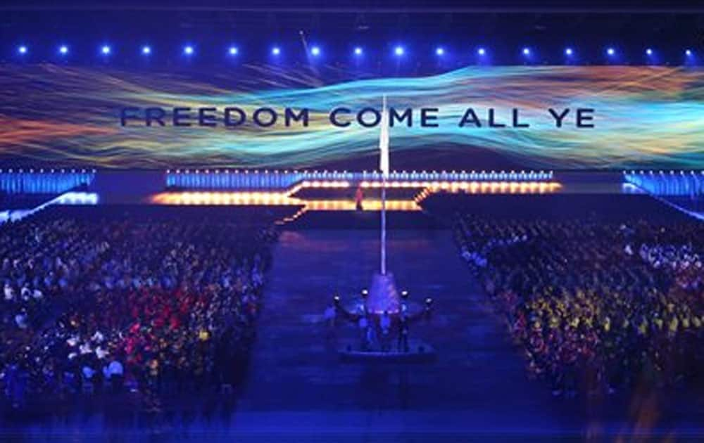 A message is displayed on a wall of video screen during the opening ceremony for the Commonwealth Games 2014 in Glasgow.