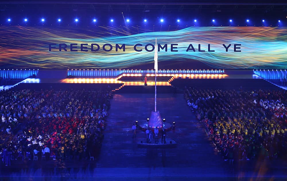 A message is displayed on a wall of video screen during the opening ceremony for the Commonwealth Games 2014 in Glasgow, Scotland.