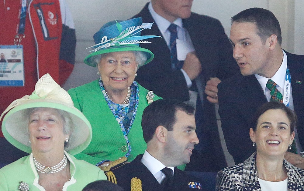 Britain's Queen Elizabeth II smiles as she watches the swimming at the Tollcross International Swimming Centre during the Commonwealth Games 2014 in Glasgow, Scotland.