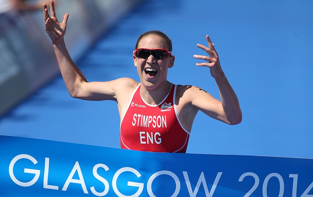 England's Jodie Stimpson celebrates after winning the women's Triathlon race at the Commonwealth Games Glasgow 2014, Strathclyde Country Park, Scotland.