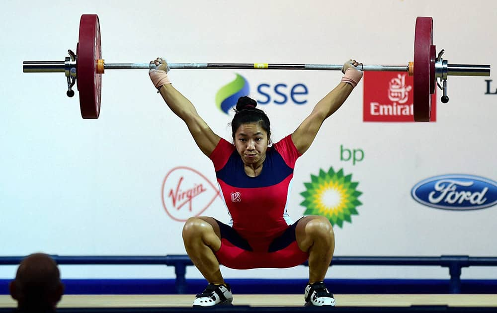 India's Chanu Saikhom completes a lift during the 48-kg women's weightlifting event at the Commonwealth Games in Glasgow, Scotland.