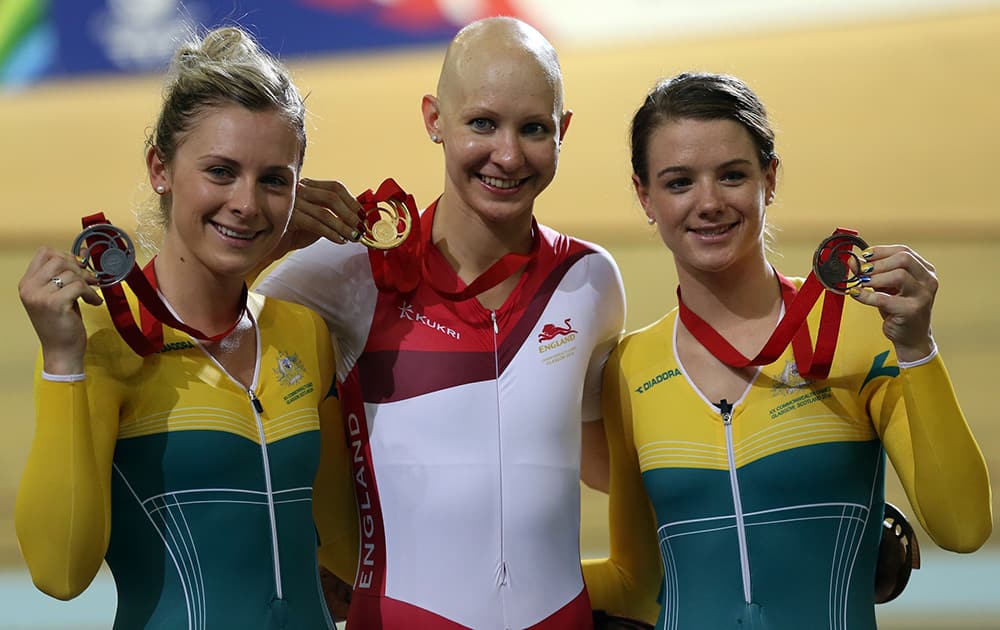 England's Joanna Rowsell celebrates with her gold medal, Australia's Annette Edmonson with her silver and Australia's Amy Cure with her bronze medal after their women's 3000m Individual pursuit at the Velodrome in Glasgow, Scotland.