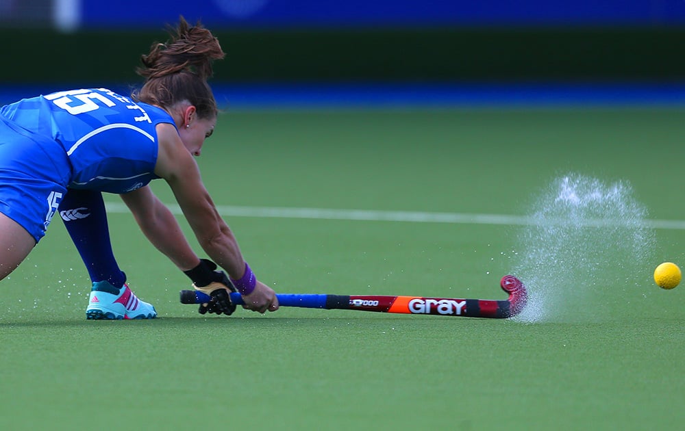 Scotland's Leigh Fawcett takes a shot at goal during their field hockey match against Malaysia at the Commonwealth Games Glasgow 2014, Glasgow National Hockey Centre, Scotland.