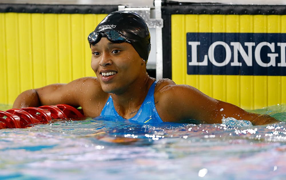 Ariel Weech of the Bahamas smiles after competing in the Women's 50m Freestyle Semifinals at the Tollcross International Swimming Centre during the Commonwealth Games 2014 in Glasgow, Scotland.