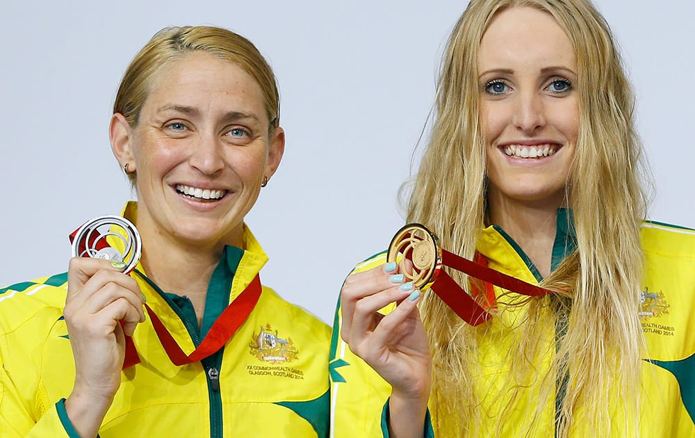 Taylor McKeown of Australia, right, winning the gold medal and Sally Hunter of Australia, winning the silver medal celebrate after the 200m breaststroke swimming competition at the Tollcross International Swimming Centre during the Commonwealth Games 2014 in Glasgow, Scotland.