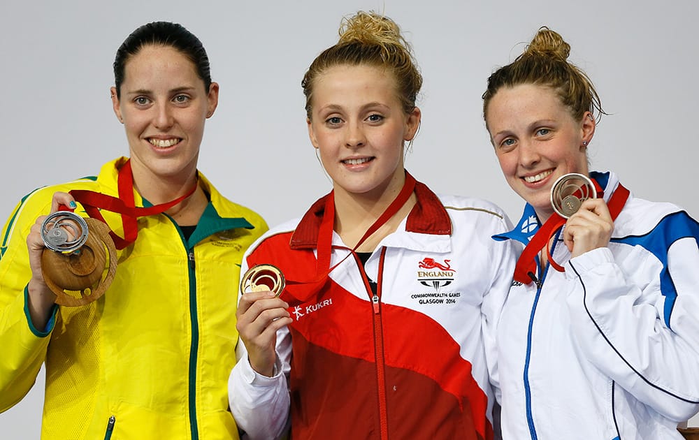 England's Siobhan O'Connor poses with the gold medal, center, Australian Alicia Coutts with silver and Scotland's Hannah Miley, right with bronze after the Women's 200m Individual Medley at the Tollcross International Swimming Centre during the Commonwealth Games 2014 in Glasgow, Scotland.