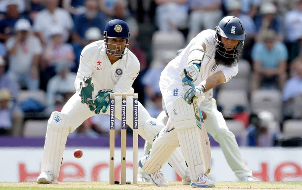 England's Moeen Ali hits a shot during the second day of the third cricket Test match of the series between England and India at The Ageas Bowl in Southampton, England.