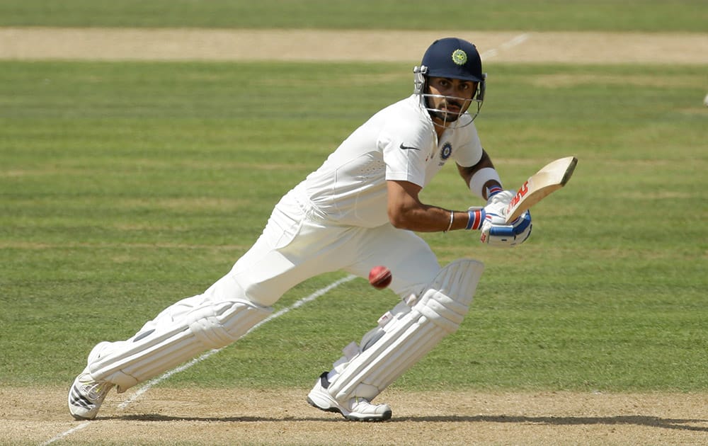 India's Virat Kohli hits a shot during the third day of the third cricket test match of the series between England and India at The Ageas Bowl in Southampton, England.