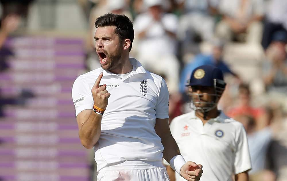 England's James Anderson celebrates taking the wicket of India's Ravindra Jadeja LBW as India's captain and wicketkeeper Mahendra Singh Dhoni, right, watches during the third day of the third cricket test match of the series between England and India at The Ageas Bowl in Southampton.