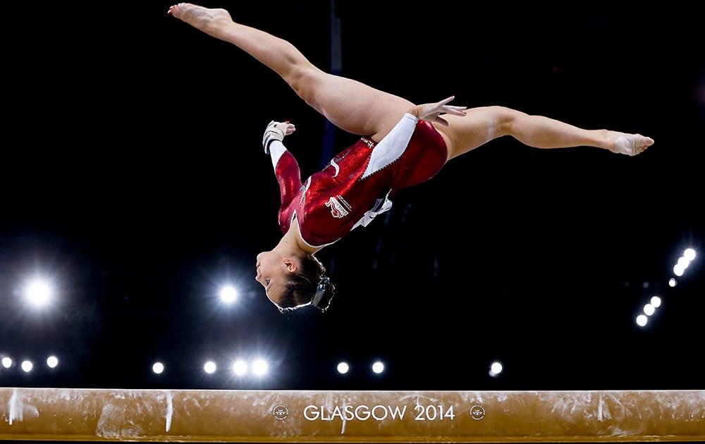 Bronze medal winner Hannah Whelan of England performs on the beam during the Women's All-Around gymnastics competition at the Scottish Exhibition Conference Centre during the Commonwealth Games 2014 in Glasgow, Scotland.