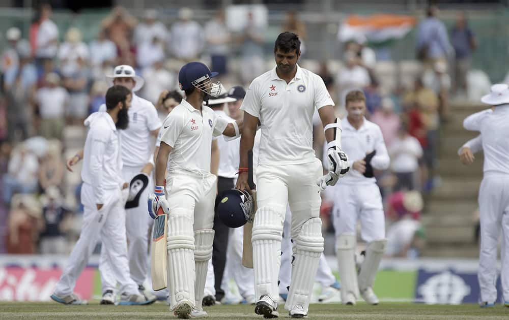 India's Ajinkya Rahane and Pankaj Singh walk off the field of play after being defeated by England after the last wicket fell of Rahane bowled out by England's Moeen Ali on the fifth and final day of the third cricket test match at The Ageas Bowl in Southampton, England.