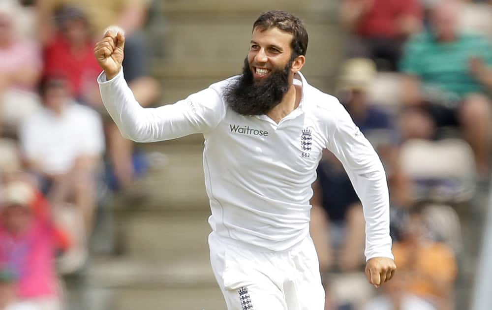 England's Moeen Ali celebrates bowling out India's Mohammed Shami during the fifth and final day of the third cricket test match of the series between England and India at The Ageas Bowl in Southampton, England.