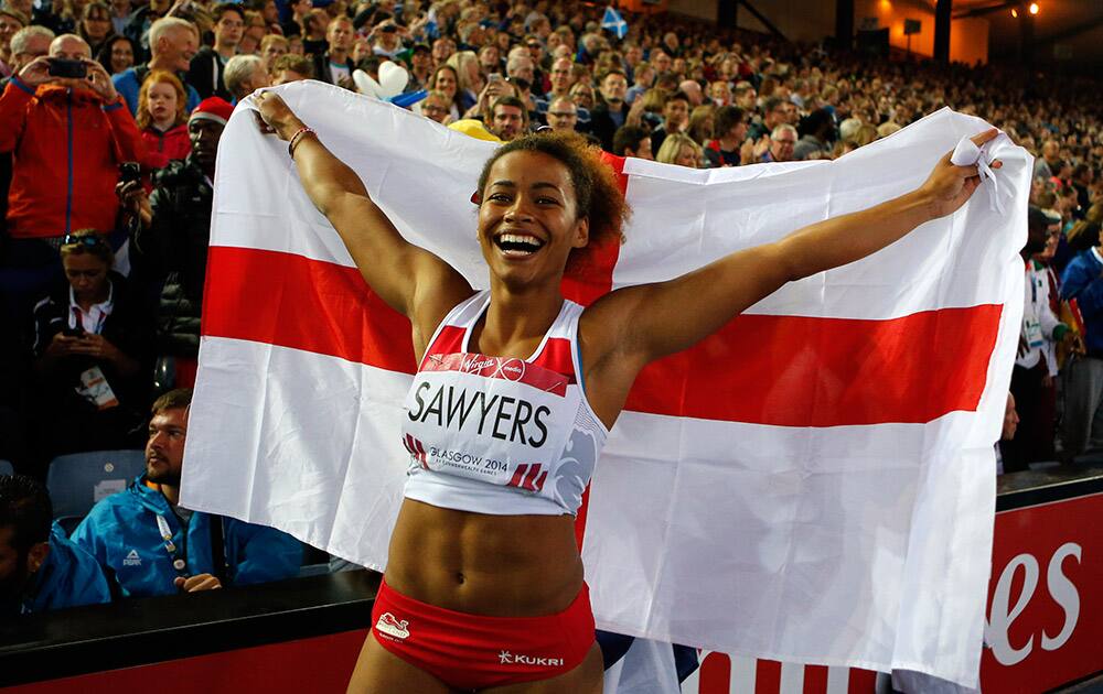 Jazmin Sawyers of England celebrates her silver medal of the women's long jump at Hampden Park Stadium during the Commonwealth Games 2014 in Glasgow, Scotland.