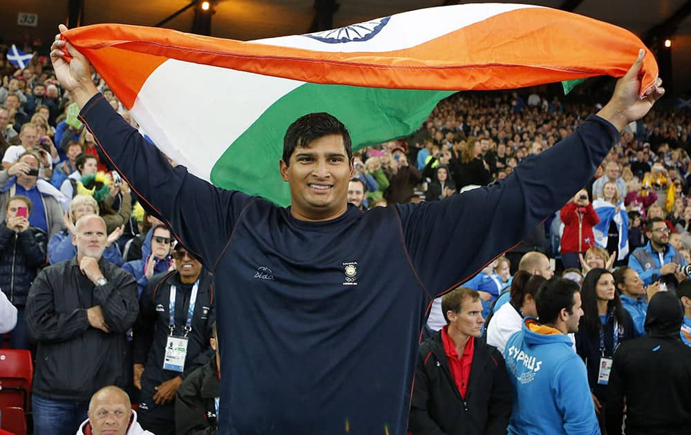 Vikas Shive Gowda of India celebrates after winning the men's discus final at Hampden Park Stadium during the Commonwealth Games 2014 in Glasgow.