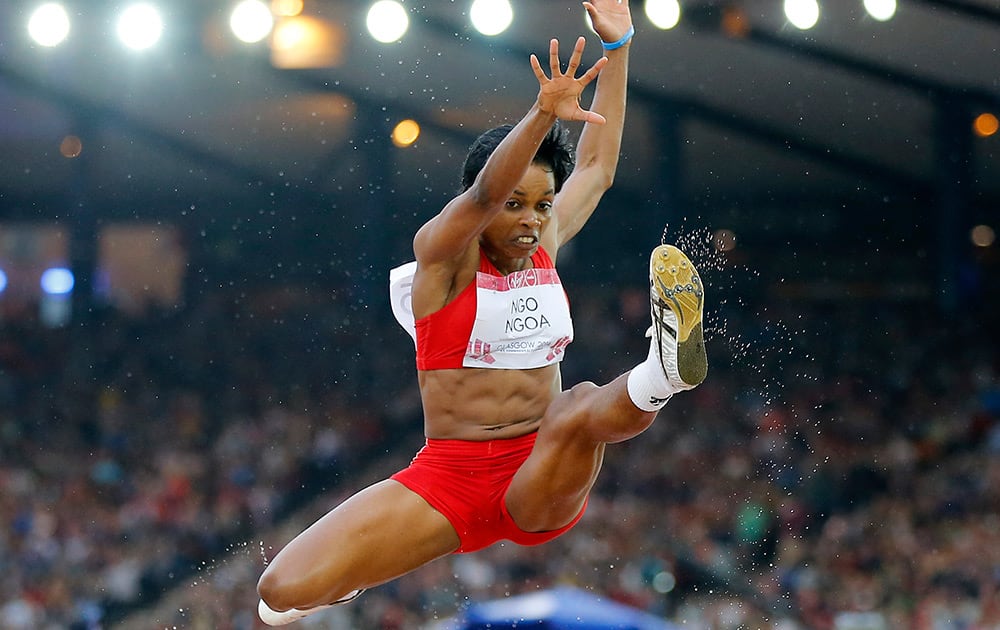 Marlyne Ngo Ngoa of Cameroon jumps during the long jump final at Hampden Park Stadium during the Commonwealth Games 2014 in Glasgow, Scotland.