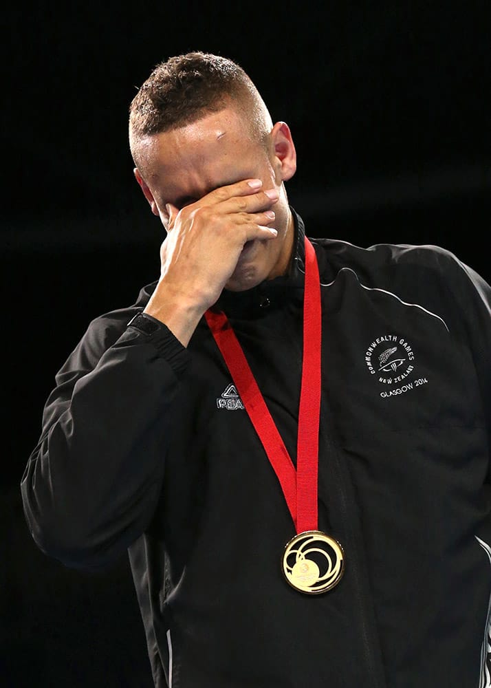 Gold medal winner David Nyika of New Zealand cries during the medals ceremony after defeating Mauritius' Kennedy Stpierre in the men's light heavyweight 81kg boxing final during the 2014 Commonwealth Games in Glasgow, Scotland.