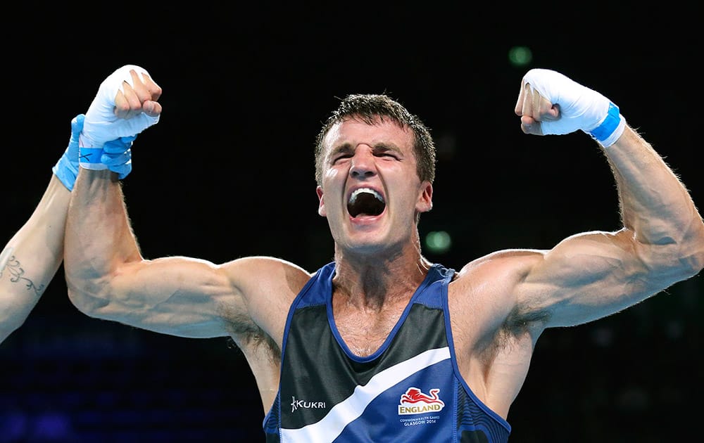 England's Anthony Fowler celebrates after defeating India's Vijender Vijender in their men's middle 75kg boxing final during the 2014 Commonwealth Games in Glasgow, Scotland.